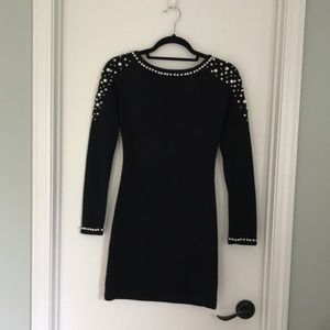 Cozy black sweater dress with pearl detailing
